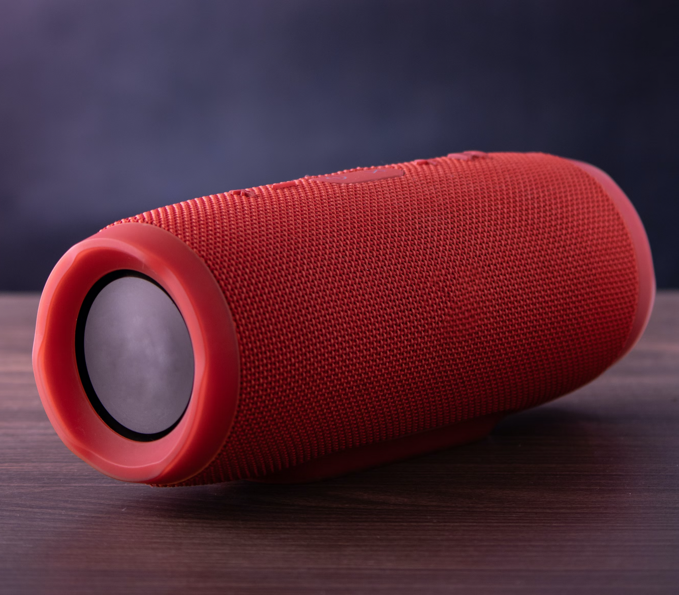 Red portable Blue Tooth speaker on a table