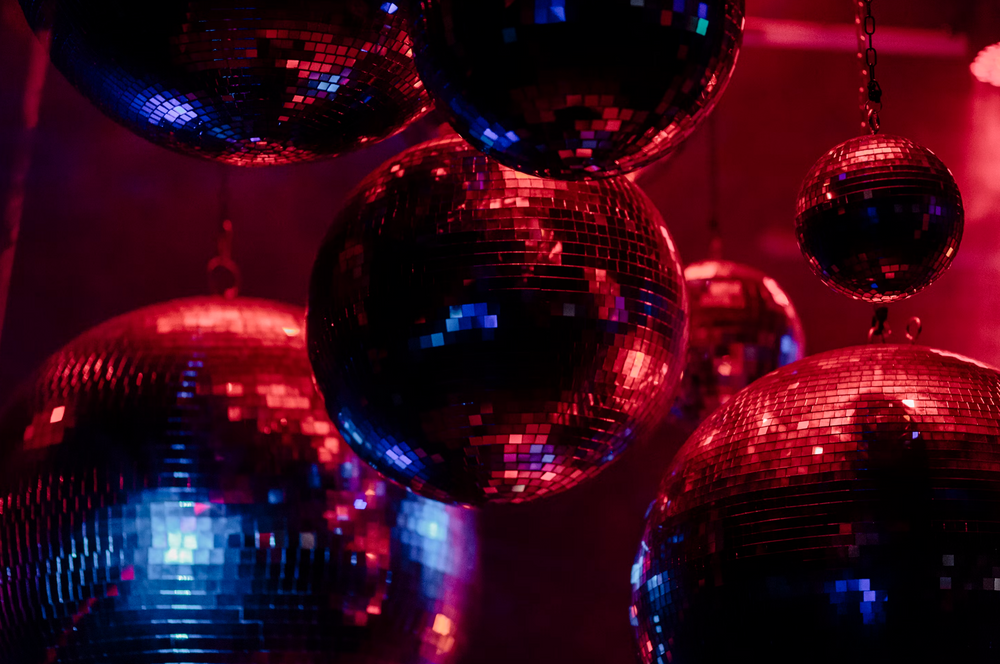 Disco balls in a red lighting