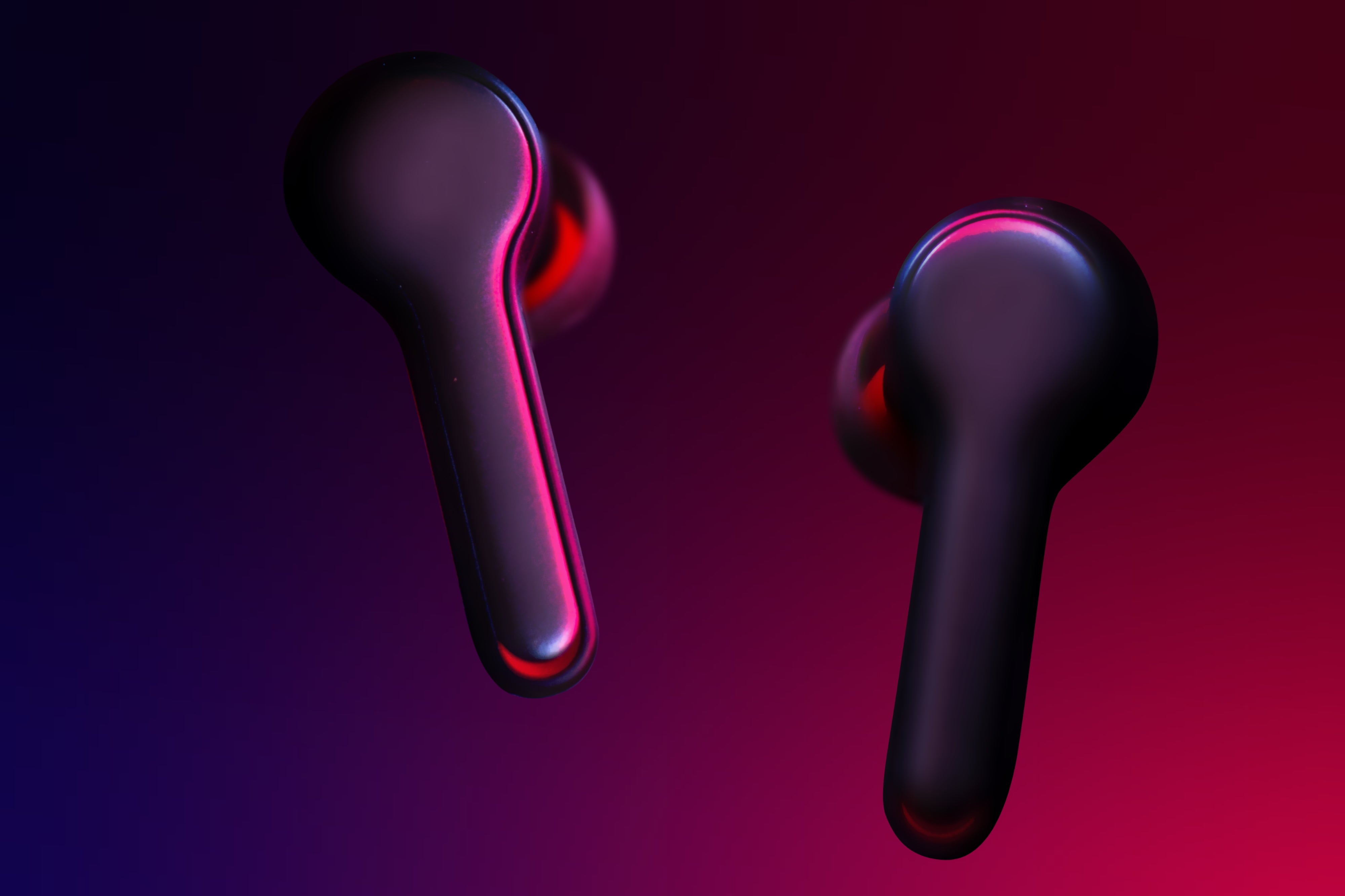 Earbuds on a pink and purple lighting