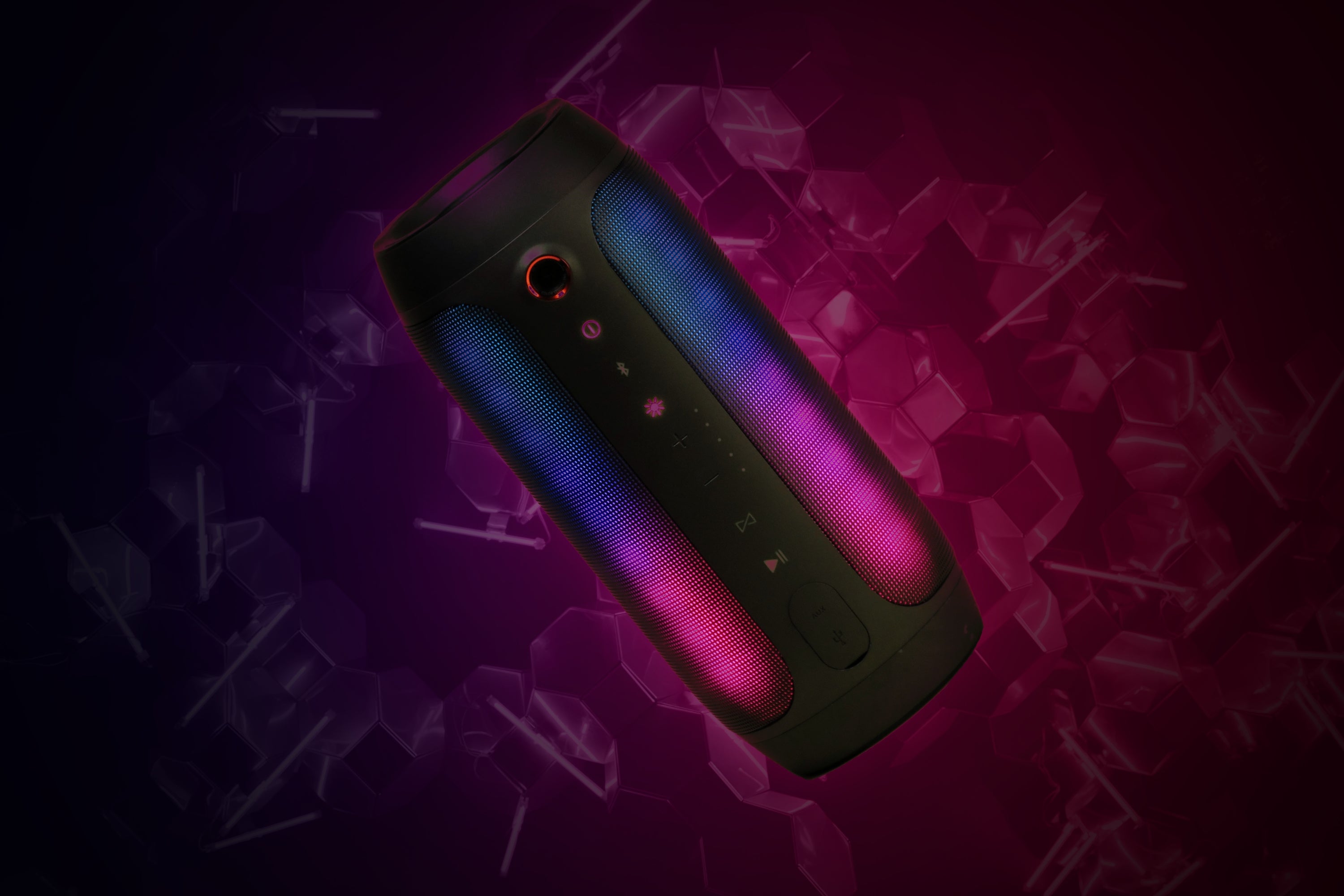 A wireless speaker in a dark pink abstract environment